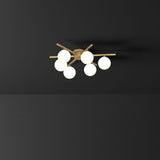 modern-mid-century-brass-ceiling-light-with-white-glass-globe-shades-and-gold-finish
