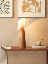 Tilt Hat Wooden Table Lamp with Conical Solid Wood Base and Triangular Fabric Shade for Modern Interiors