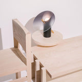 modern-interactive-glass-disc-table-lamp-with-rotating-brass-shaft-and-dimming-control