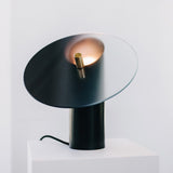 modern-interactive-glass-disc-table-lamp-with-rotating-brass-shaft-and-dimming-control