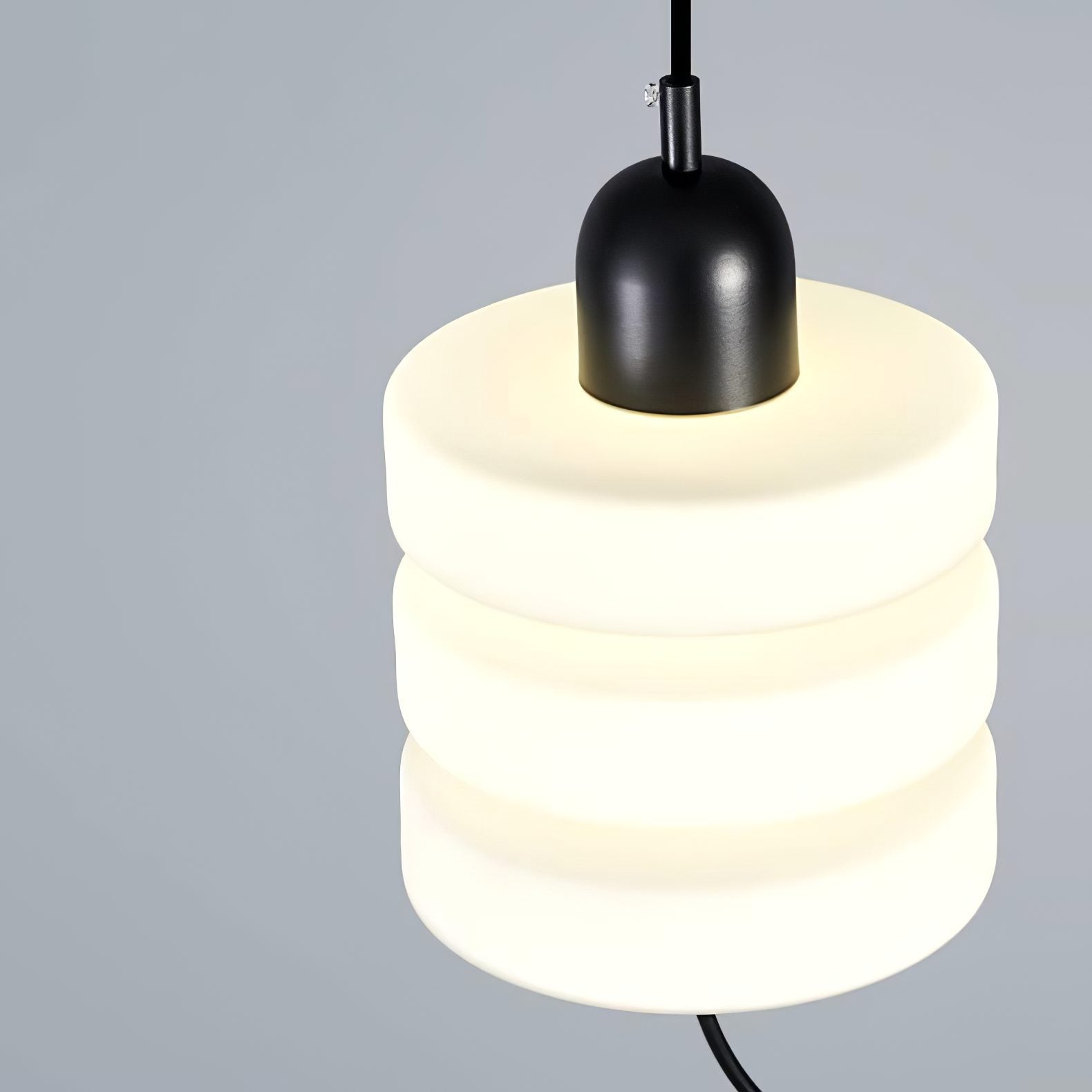 modern-triple-puck-led-pendant-light-with-ice-glazed-glass-diffuser-and-machined-iron-base