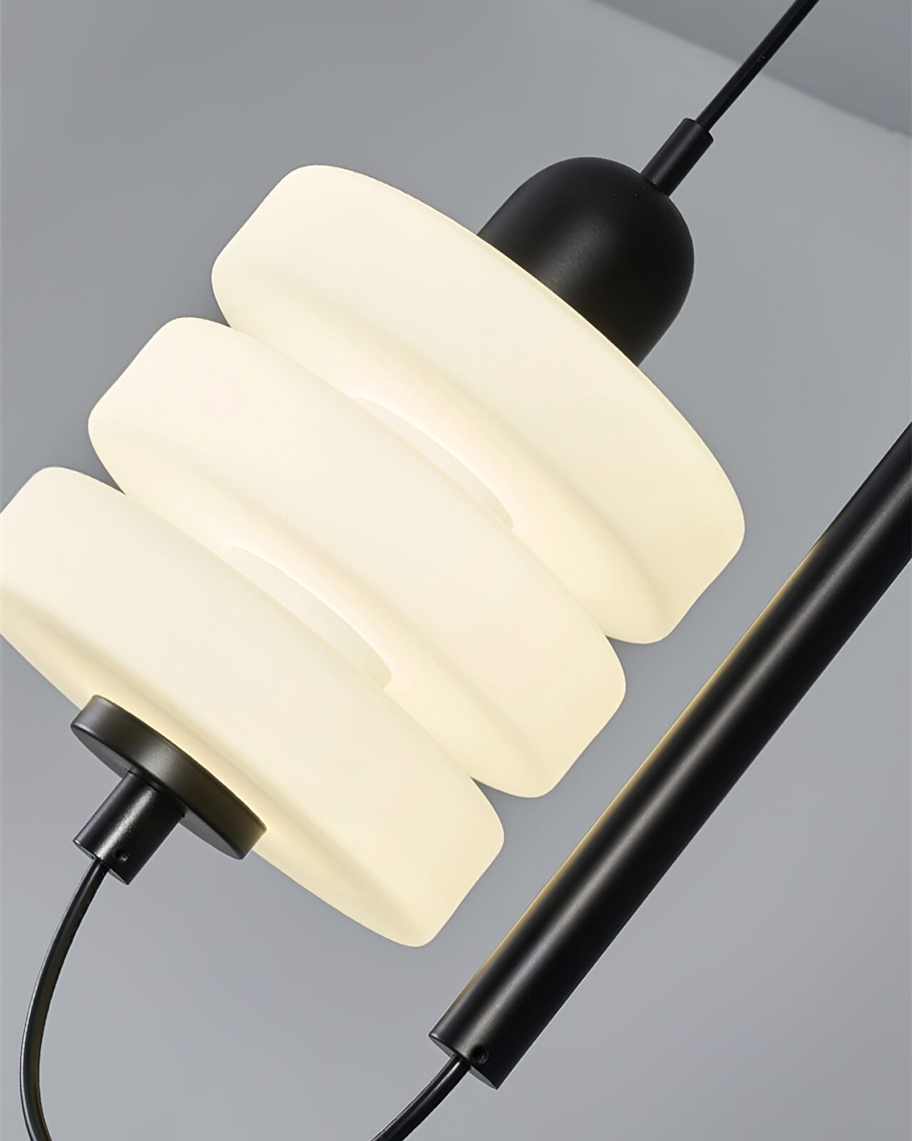 modern-triple-puck-led-pendant-light-with-ice-glazed-glass-diffuser-and-machined-iron-base