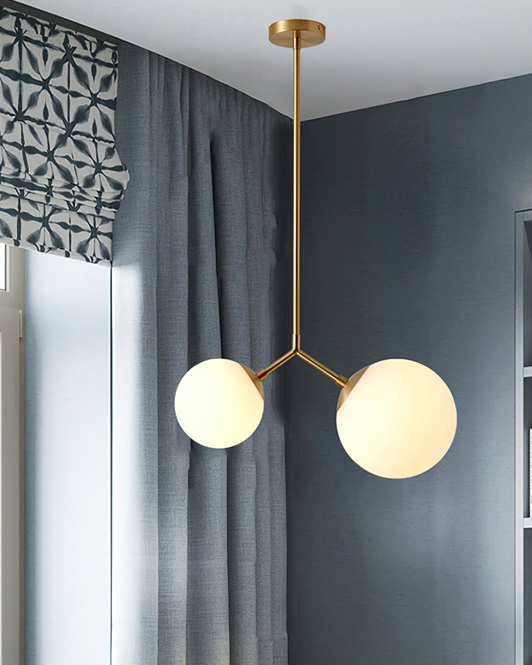 modern-asymmetric-glass-globe-pendant-light-with-brass-accents-and-hand-blown-glass