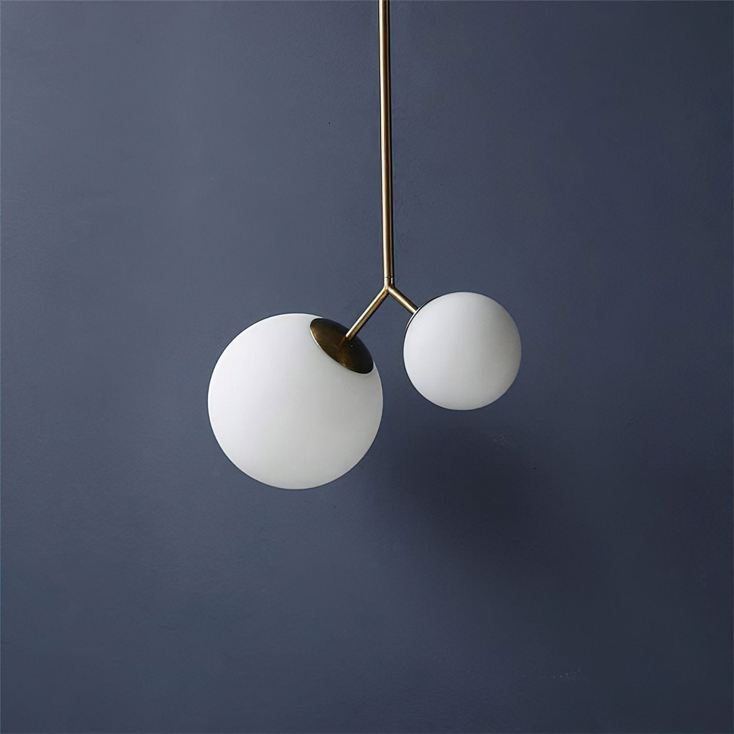 modern-asymmetric-glass-globe-pendant-light-with-brass-accents-and-hand-blown-glass
