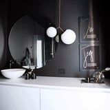 modern-asymmetric-glass-globe-pendant-light-with-brass-accents-and-hand-blown-glass