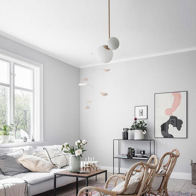 modern-asymmetric-glass-globe-pendant-light-with-brass-accents-and-hand-blown-glass