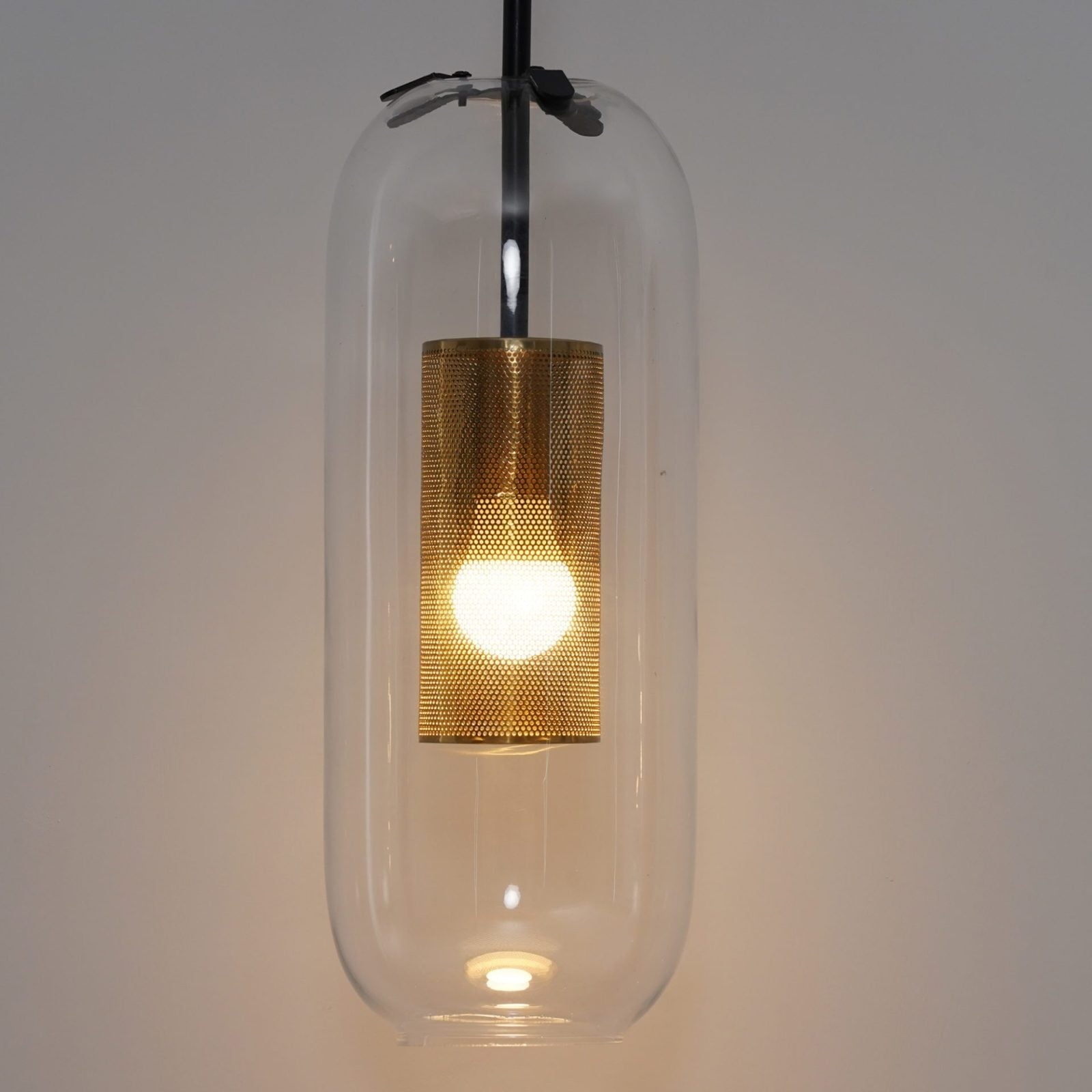 modern-vadim-glass-wall-sconce-with-perforated-metal-cage-and-brass-finish-for-luxury-interiors