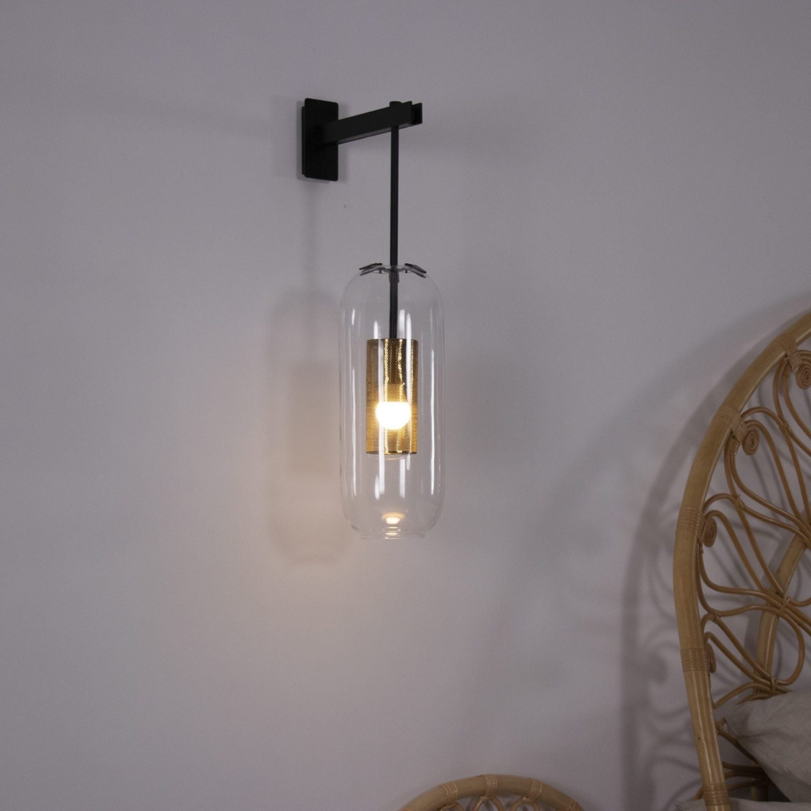 modern-vadim-glass-wall-sconce-with-perforated-metal-cage-and-brass-finish-for-luxury-interiors