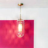 vadim-modern-glass-globe-pendant-light-with-gold-steel-rod-and-perforated-cage