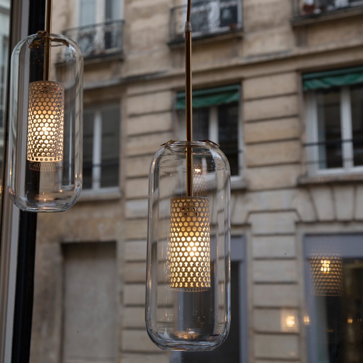 vadim-modern-glass-globe-pendant-light-with-gold-steel-rod-and-perforated-cage
