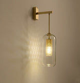 modern-vadim-glass-wall-sconce-with-perforated-metal-cage-and-brass-finish-for-luxury-interiors