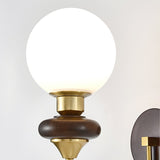 mid-century-walnut-wood-wall-sconce-lighting-with-white-glass-shade-and-pull-cord-switch