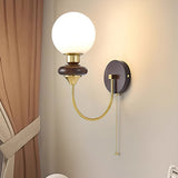 mid-century-walnut-wood-wall-sconce-lighting-with-white-glass-shade-and-pull-cord-switch