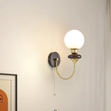 mid-century-walnut-wood-wall-sconce-lighting-with-white-glass-shade-and-pull-cord-switch