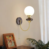mid-century-walnut-wood-wall-sconce-lighting-with-white-glass-shade-and-pull-cord-switch