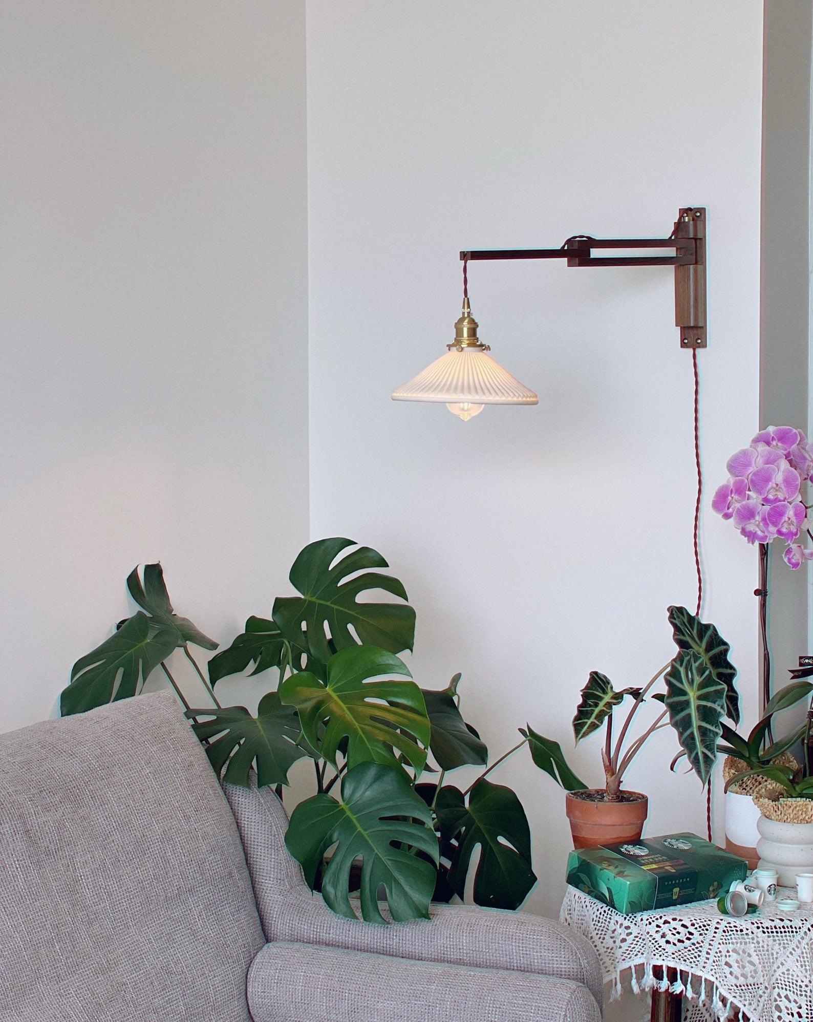 modern-walnut-wood-retractable-wall-sconce-with-pleated-ceramic-shade-and-adjustable-arm