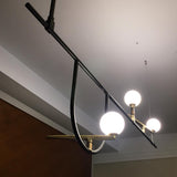 modern-minimalist-branch-chandelier-with-brass-bird-figures-and-white-glass-spheres