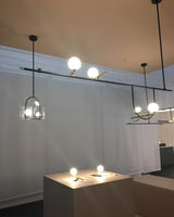 modern-minimalist-branch-chandelier-with-brass-bird-figures-and-white-glass-spheres