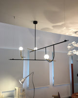 modern-minimalist-branch-chandelier-with-brass-bird-figures-and-white-glass-spheres