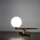 modern-yanzi-style-led-table-lamp-with-white-glass-globe-and-gold-metal-finish