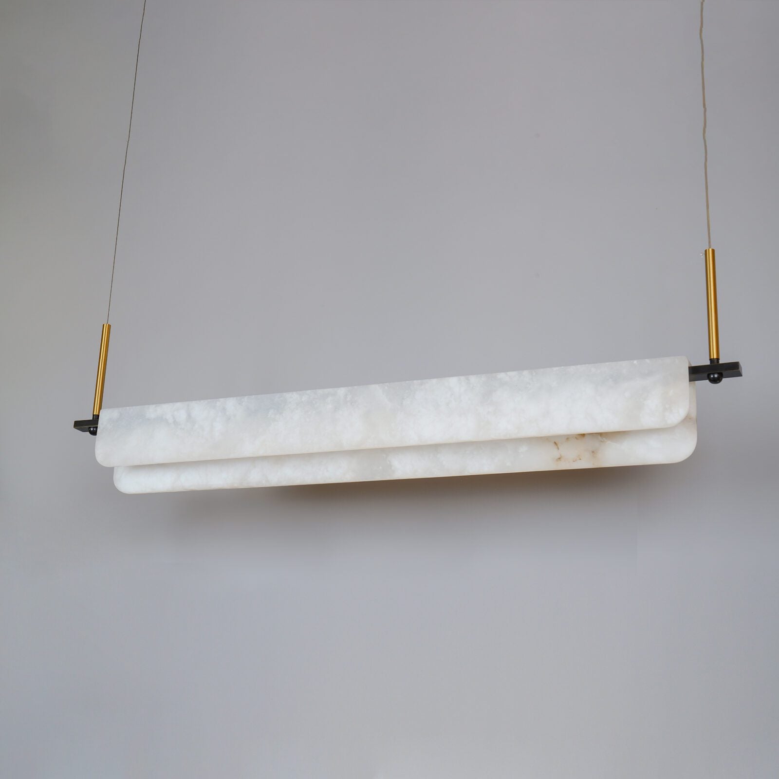 modern-linear-alabaster-led-pendant-light-with-brass-architectural-accents-for-home-dining