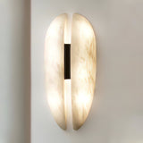 modern-symmetrical-curved-alabaster-led-wall-light-zelda-sconce-for-living-areas