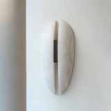 modern-symmetrical-curved-alabaster-led-wall-light-zelda-sconce-for-living-areas