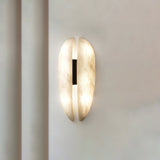 modern-symmetrical-curved-alabaster-led-wall-light-zelda-sconce-for-living-areas