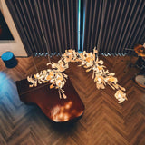 artistic-gingko-branch-chandelier-with-handcrafted-white-ceramic-leaves-and-gold-finish
