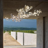 artistic-gingko-branch-chandelier-with-handcrafted-white-ceramic-leaves-and-gold-finish