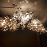 artistic-gingko-branch-chandelier-with-handcrafted-white-ceramic-leaves-and-gold-finish
