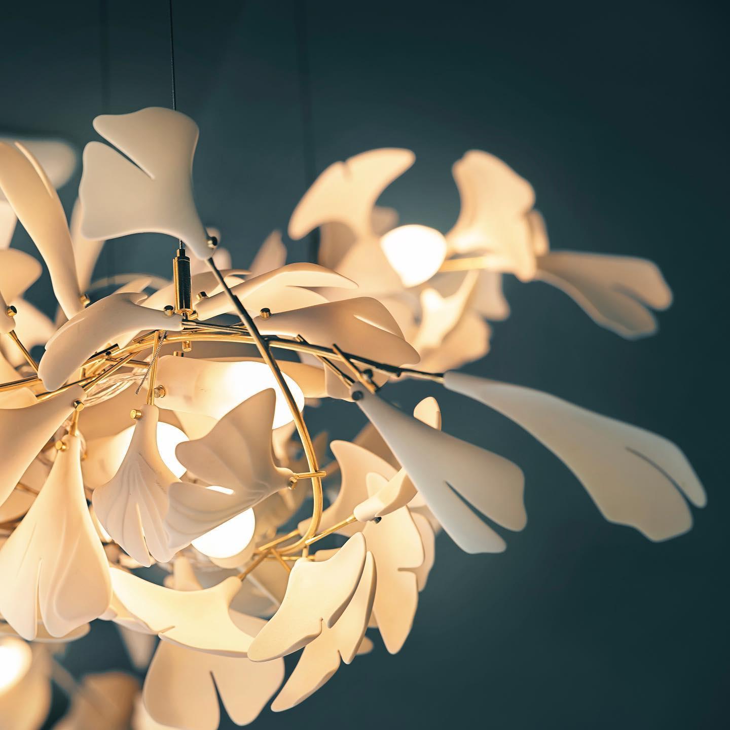 artistic-gingko-branch-chandelier-with-handcrafted-white-ceramic-leaves-and-gold-finish