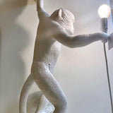 Artistic Monkey Resin Wall Sconce Whimsical Animal Design Interior Light