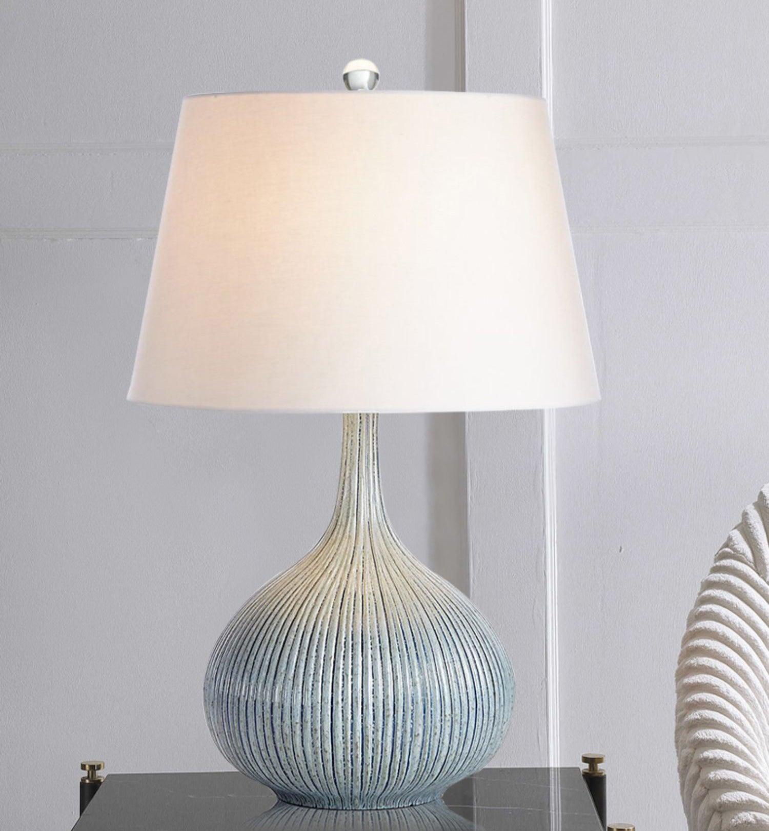 blue-sculptural-ceramic-table-lamp-with-white-fabric-shade-for-contemporary-living-room-decor