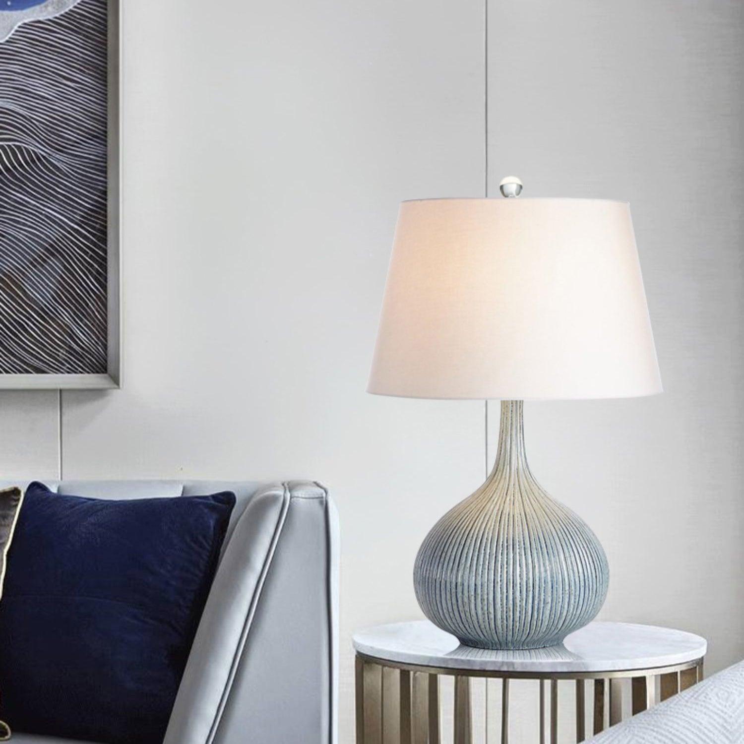 blue-sculptural-ceramic-table-lamp-with-white-fabric-shade-for-contemporary-living-room-decor