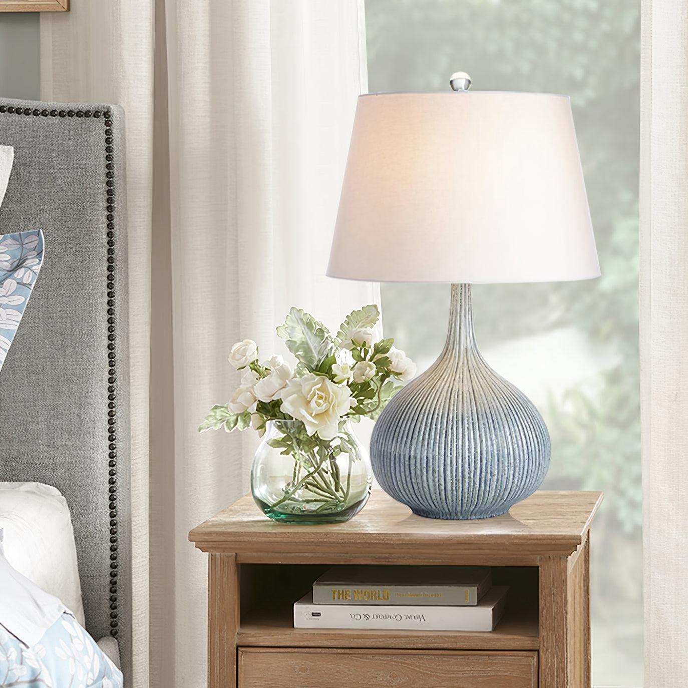 blue-sculptural-ceramic-table-lamp-with-white-fabric-shade-for-contemporary-living-room-decor