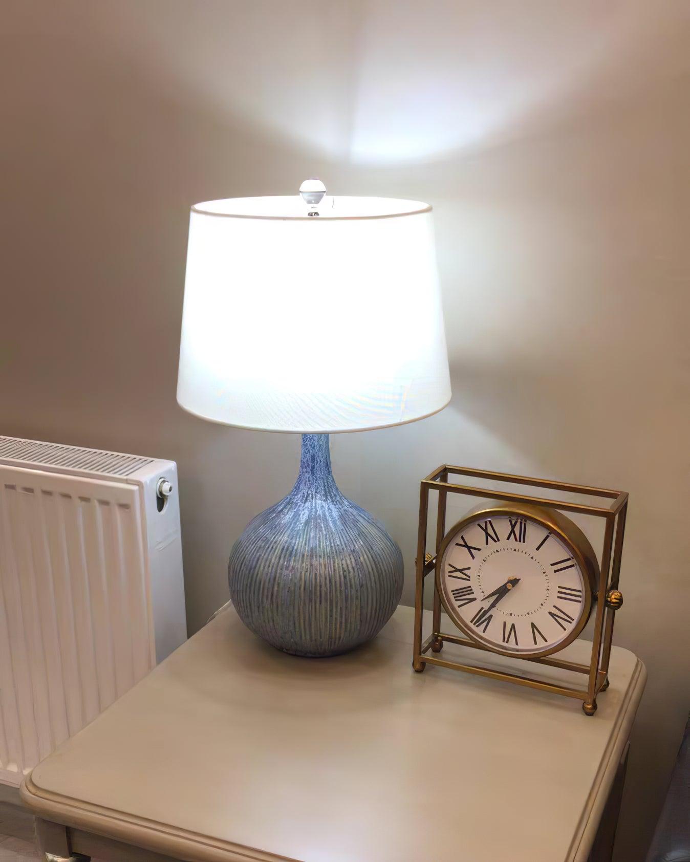 blue-sculptural-ceramic-table-lamp-with-white-fabric-shade-for-contemporary-living-room-decor