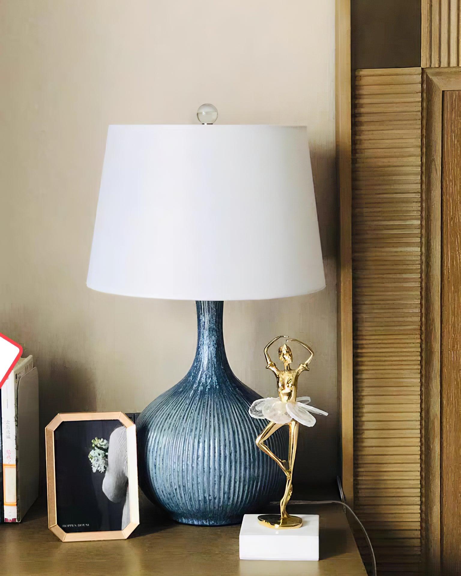 blue-sculptural-ceramic-table-lamp-with-white-fabric-shade-for-contemporary-living-room-decor