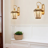 brass-and-glass-palace-pattern-exterior-wall-sconce-lighting-for-outdoor-patios-and-gardens