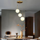 Contemporary Gold Globe Pendant Lighting with White Frosted Glass Shades for Kitchen