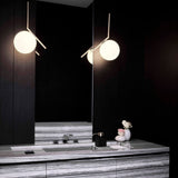 Contemporary Minimalist Equilibrium Glass Globe Pendant Light with Brass and Black Finishes