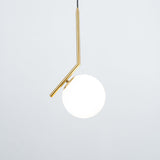 Contemporary Minimalist Equilibrium Glass Globe Pendant Light with Brass and Black Finishes