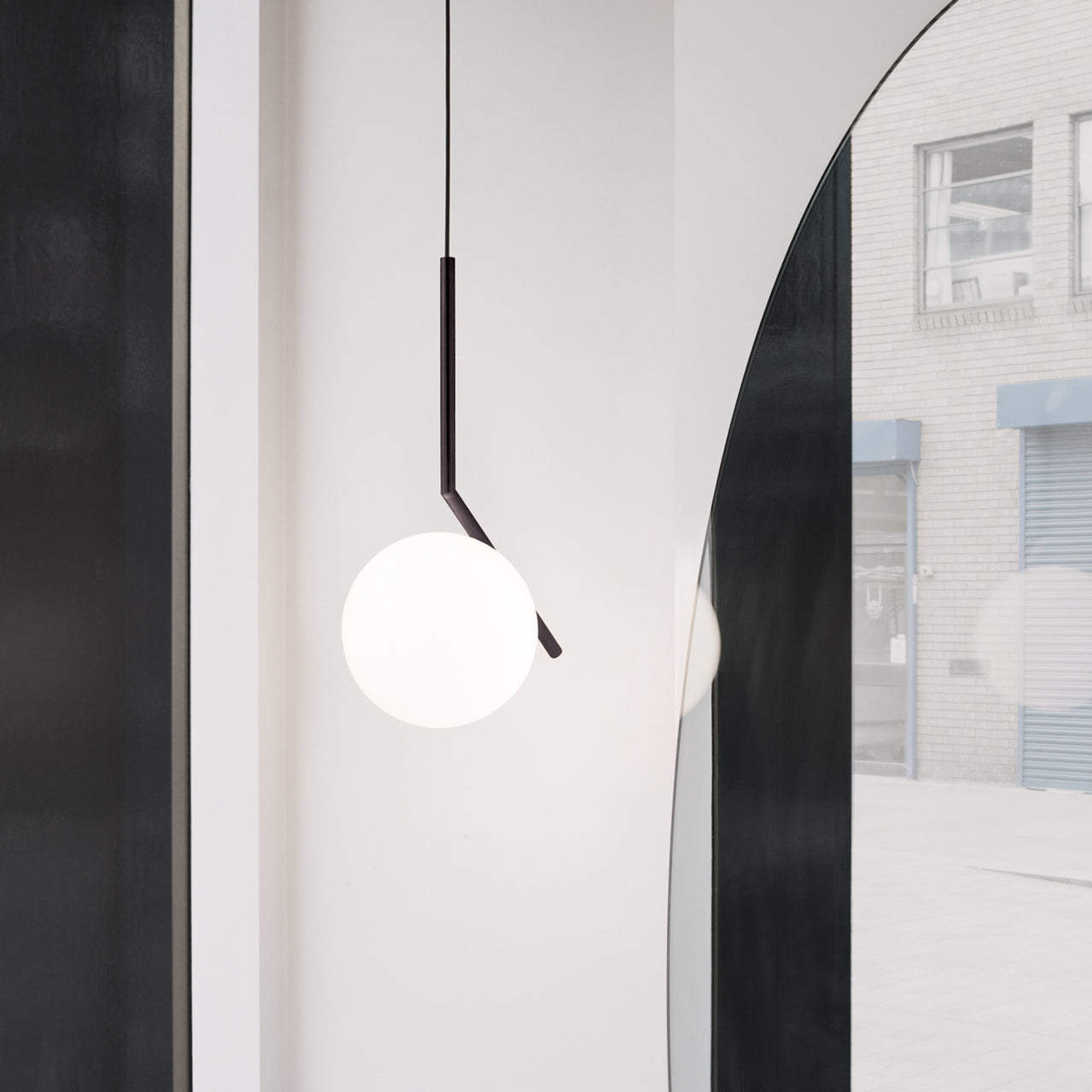 Contemporary Minimalist Equilibrium Glass Globe Pendant Light with Brass and Black Finishes