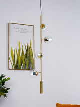 Contemporary Orb Glass Globe Vertical Pendant Light Brass and Glass Multi Light Fixture