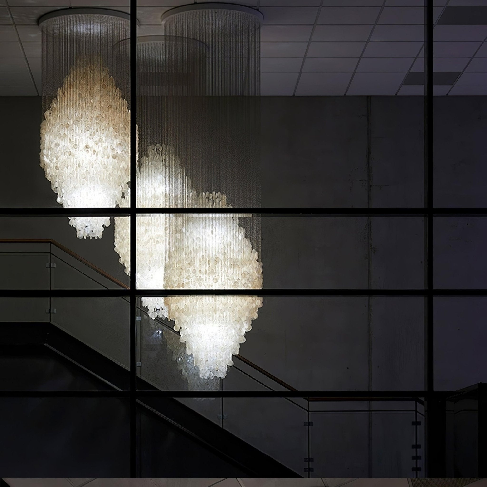 Elegant Coastal Shell Waterfall Chandelier with Cascading White Shell Discs for High Ceiling Spaces