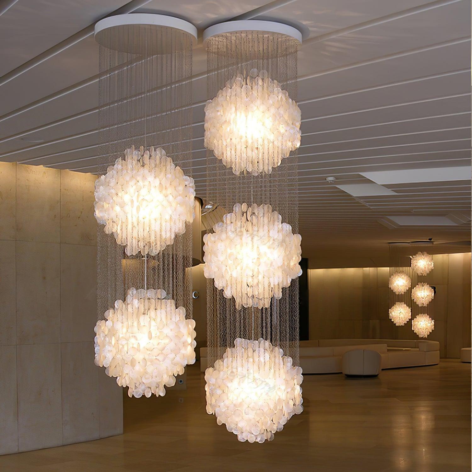 Elegant Coastal Shell Waterfall Chandelier with Cascading White Shell Discs for High Ceiling Spaces