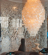 Elegant Coastal Shell Waterfall Chandelier with Cascading White Shell Discs for High Ceiling Spaces