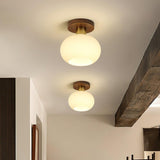 elegant-white-shell-ceiling-lamp-with-black-walnut-wood-base-and-copper-accents