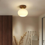 elegant-white-shell-ceiling-lamp-with-black-walnut-wood-base-and-copper-accents