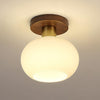elegant-white-shell-ceiling-lamp-with-black-walnut-wood-base-and-copper-accents